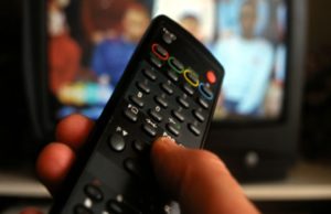Hand-holding-TV-remote-co-007